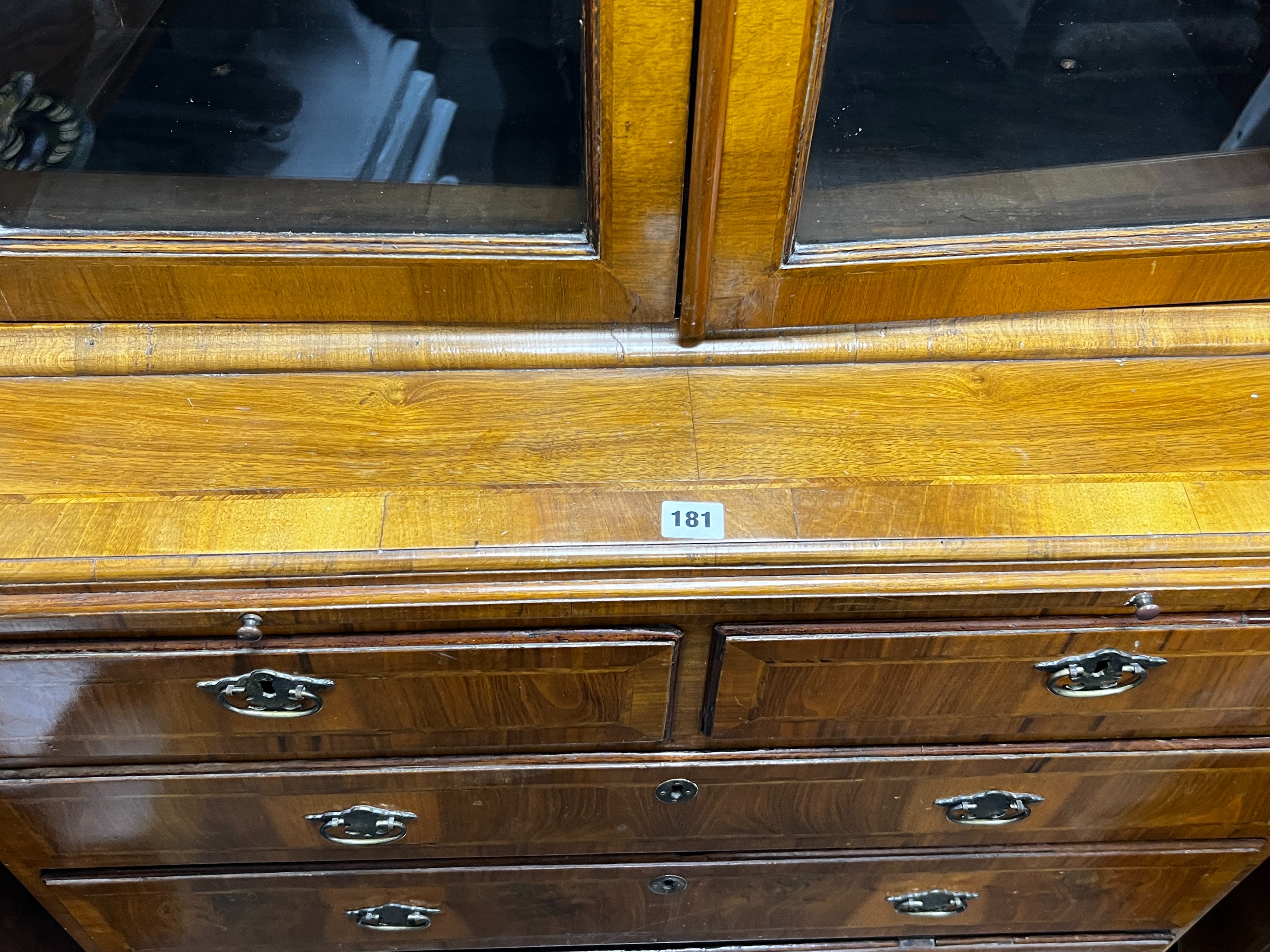 A Queen Anne revival feather banded walnut cabinet on chest, width 91cm, depth 47cm, height 193cm